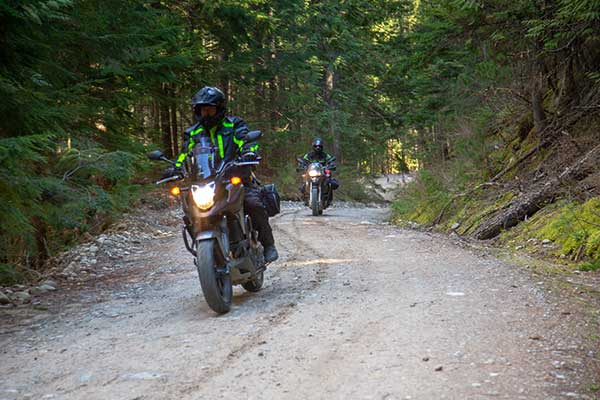 2 bikers on a dirt road